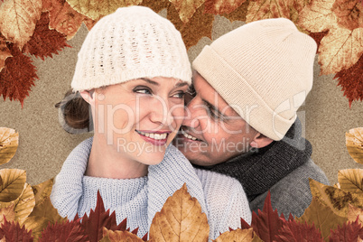 Composite image of casual couple in warm clothing