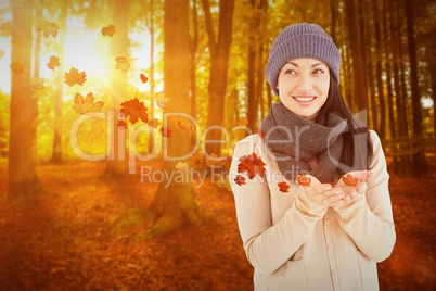 Composite image of smiling brunette presenting her hands