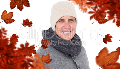 Composite image of casual man in warm clothing