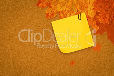 Composite image of  sticky note with grey paperclip