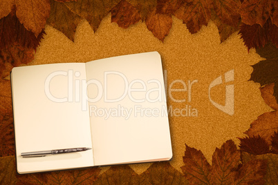 Composite image of notebook and pen