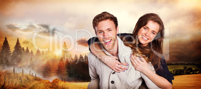 Composite image of smiling young man carrying woman