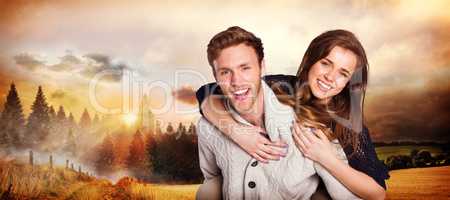 Composite image of smiling young man carrying woman