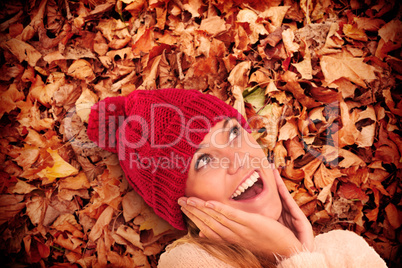 Composite image of happy blonde in winter clothes