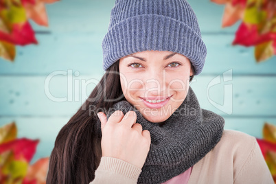 Composite image of attractive brunette looking at camera wearing