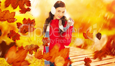 Composite image of happy brunette in winter clothes posing