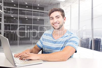 Composite image of student on laptop