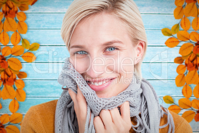 Composite image of smiling woman wearing a scarf