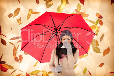 Composite image of sick brunette blowing her nose while holding
