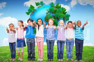 Composite image of cute pupils smiling at camera in classroom