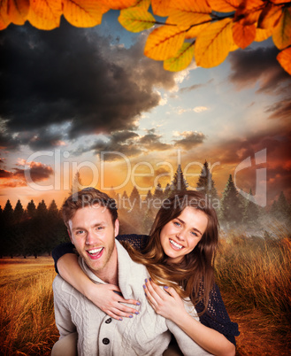 Composite image of smiling young man carrying woman