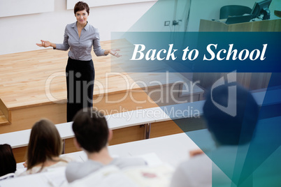 Back to school against teacher standing talking to the students