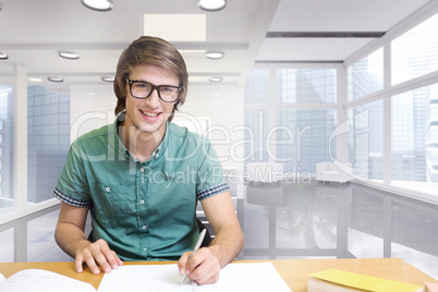 Composite image of student sitting in library writing