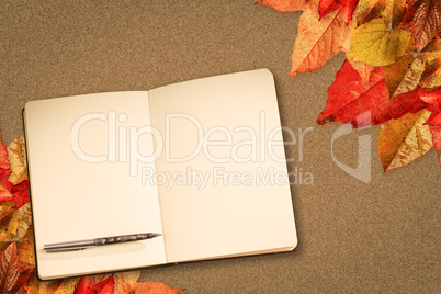 Composite image of notebook and pen