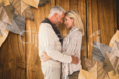 Composite image of side view of cute couple embracing each other