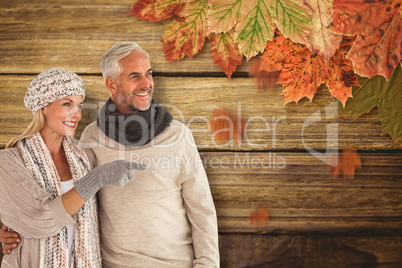 Composite image of wife pointing finger while standing besides h