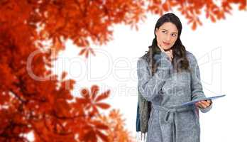 Composite image of pensive model wearing winter clothes holding
