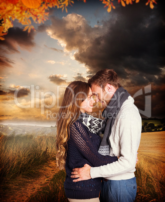 Composite image of side view of young couple embracing