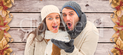 Composite image of young winter couple