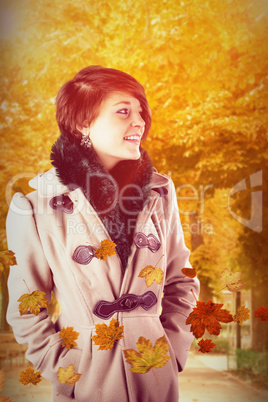 Composite image of smiling beautiful woman in winter coat