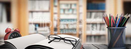 Composite image of school supplies on desk