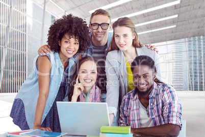 Composite image of fashion students working as a team