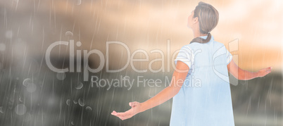 Composite image of woman with arms outstretched over white backg