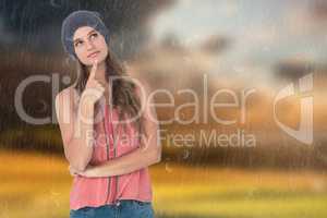 Composite image of thoughtful woman wearing hat with finger on c