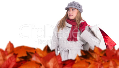 Composite image of happy blonde in winter clothes posing