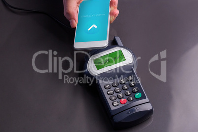 Composite image of mobile phone screen showing payment successfu