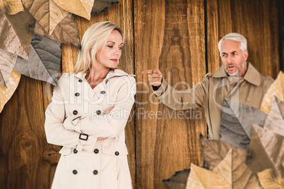 Composite image of angry husband pointing wife