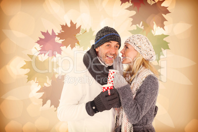 Composite image of happy couple gossiping while drinking hot tea