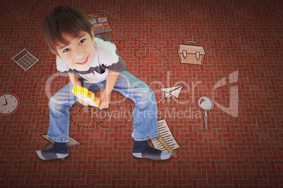 Composite image of cute boy sitting with building blocks