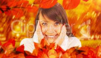 Composite image of brunette in winter clothes smiling at camera