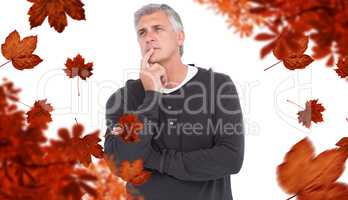 Composite image of casual man thinking with hand on chin