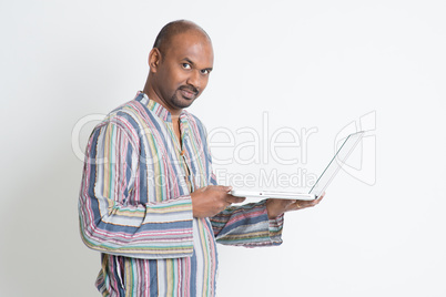 Indian male using computer