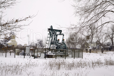 Oil wells at snow