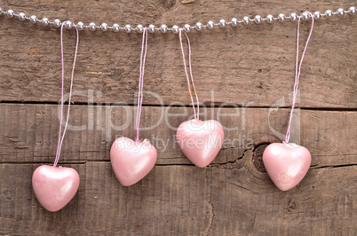 Vintage heart shapes on a wooden background