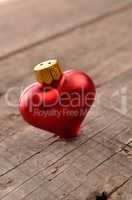 Red heart shape on a wooden table