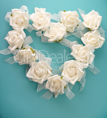 Heart shape of white roses