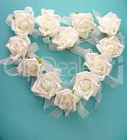 Heart shape of white roses