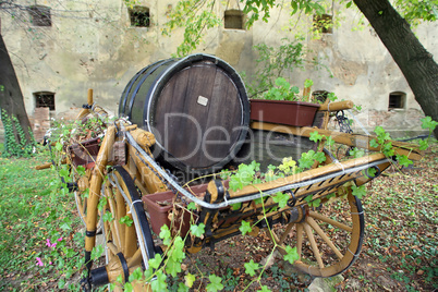 Old wooden barrel on the carriage