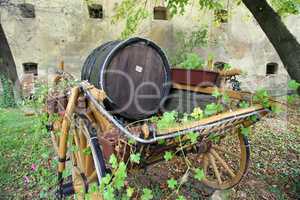 Old wooden barrel on the carriage