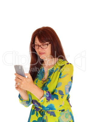 Businesswoman looking at cell phone.