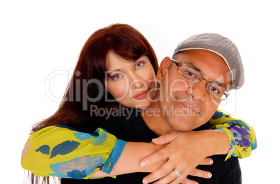 Wife hugging her husband.