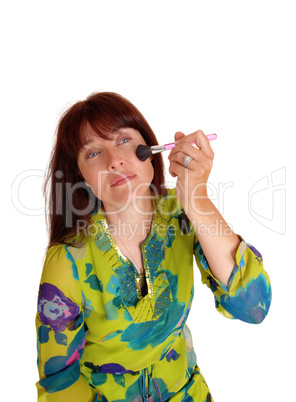 Woman putting on makeup.