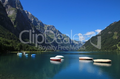 Boats on the shore of lake Klontalersee
