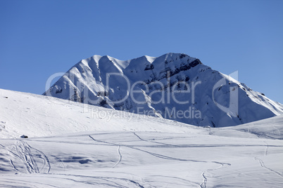 Off-piste slope in sun morning