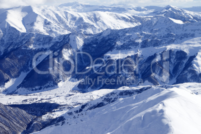 Top view on snowy mountains and off-piste slope