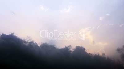 Time lapse of clouds on sunset sky